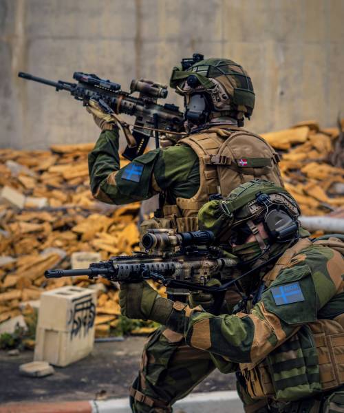 A closeup of lurking special forces soldiers with weapons