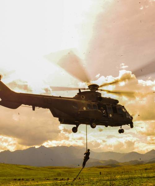 silhouette-of-person-hanging-into-rope-from-a-heli-2023-11-27-04-55-10-utc